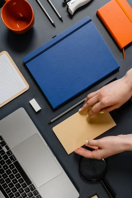 home-hero-bg Planner open on a desk with handwritten Holiday Email Marketing Series note.